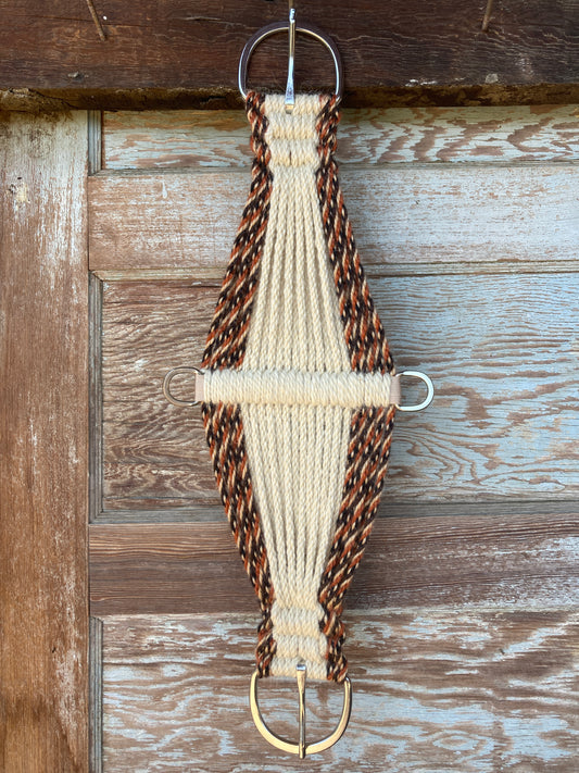 A brown, burnt orange, and beige mohair cinch with a nylon center and stainless steel hardware, handmade/handtied in California USA.
